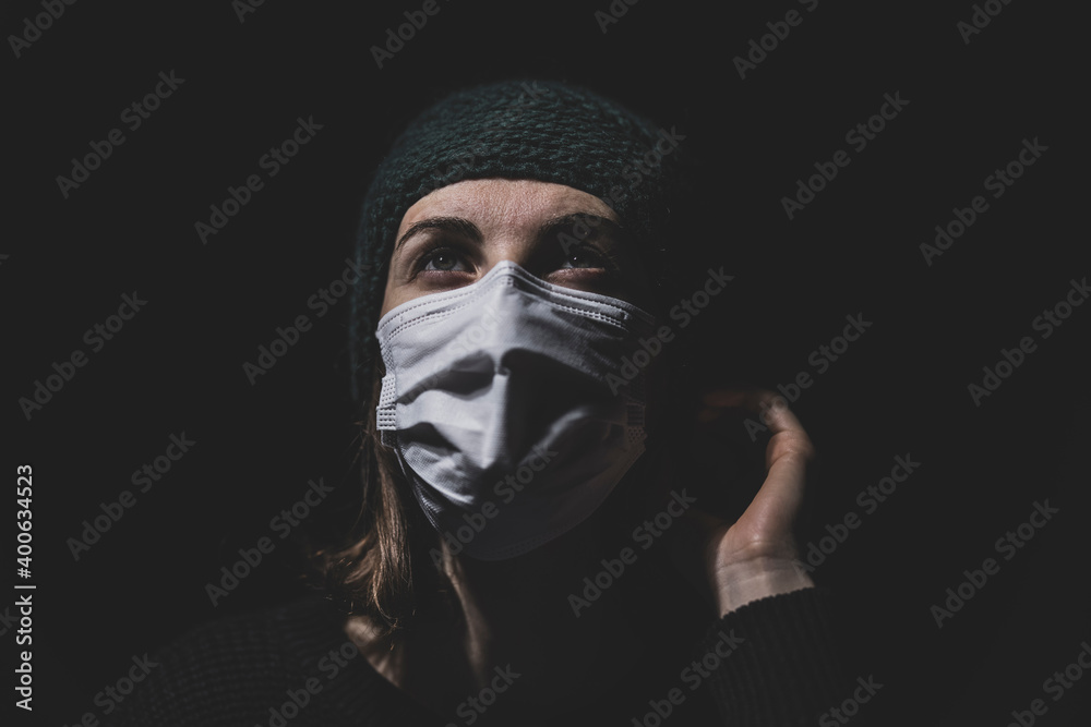 a woman protected from coronavirus with a mask a woman protected from coronavirus with a mask