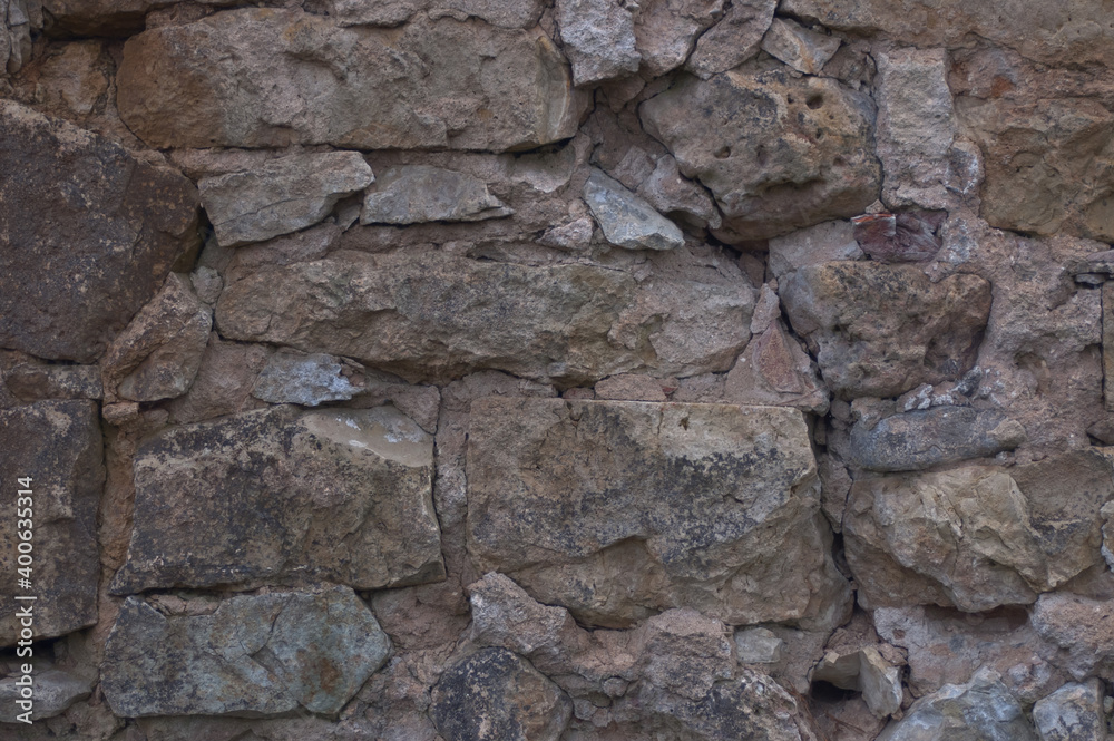 background of stone. in the photo, the stone wall of the old building background of stone. in the photo, the stone wall of the old building