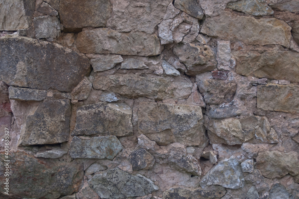 background of stone. in the photo, the stone wall of the old building background of stone. in the photo, the stone wall of the old building