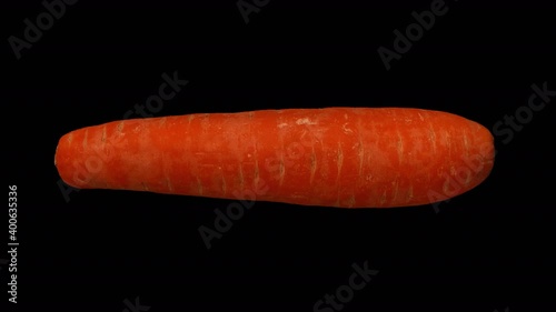 Realistic render of a rotating carrot on transparent background (with alpha channel). The video is seamlessly looping, and the object is 3D scanned from a real carrot.
