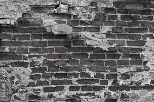 gray brick background. in the photo, the brick wall of the old building