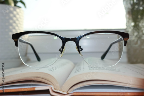 Glasses on the book