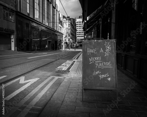 Birmingham, United Kingdom - December 12 2020: Christmas 'Have a Merry Yuletide' message on chalk A-board outside café