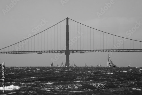 Golden Gate Bridge with sailboats in black and white