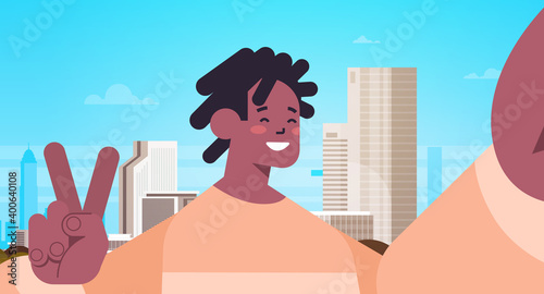 happy african american man taking selfie on smartphone camera guy making self photo cityscape background horizontal portrait vector illustration