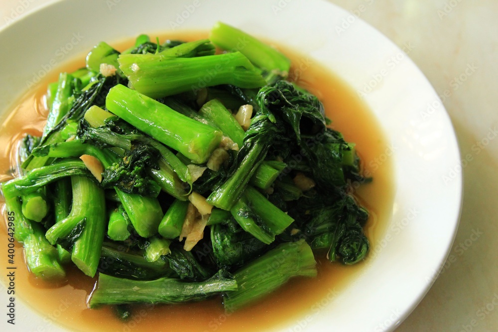Stir -fried choy sum vegetable on the plate. stock photo