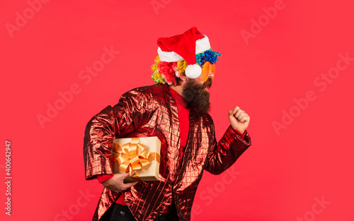 Christmas gift. Disco party. Bearded man celebrate christmas. Christmas entertainment ideas. Wishing you peace and prosperity. Cheerful guy colorful hairstyle. Funny man with beard. Winter holidays