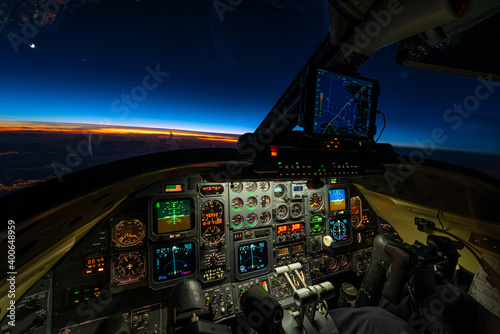 Cruising into the night at 41.000 Feet
View from the cockpit of a classic business jet at 41.000 feet chasing the sunset with all colors nature has in its portfolio for such an event. Flying at a grou