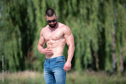 Model Flexing Muscles Outdoors