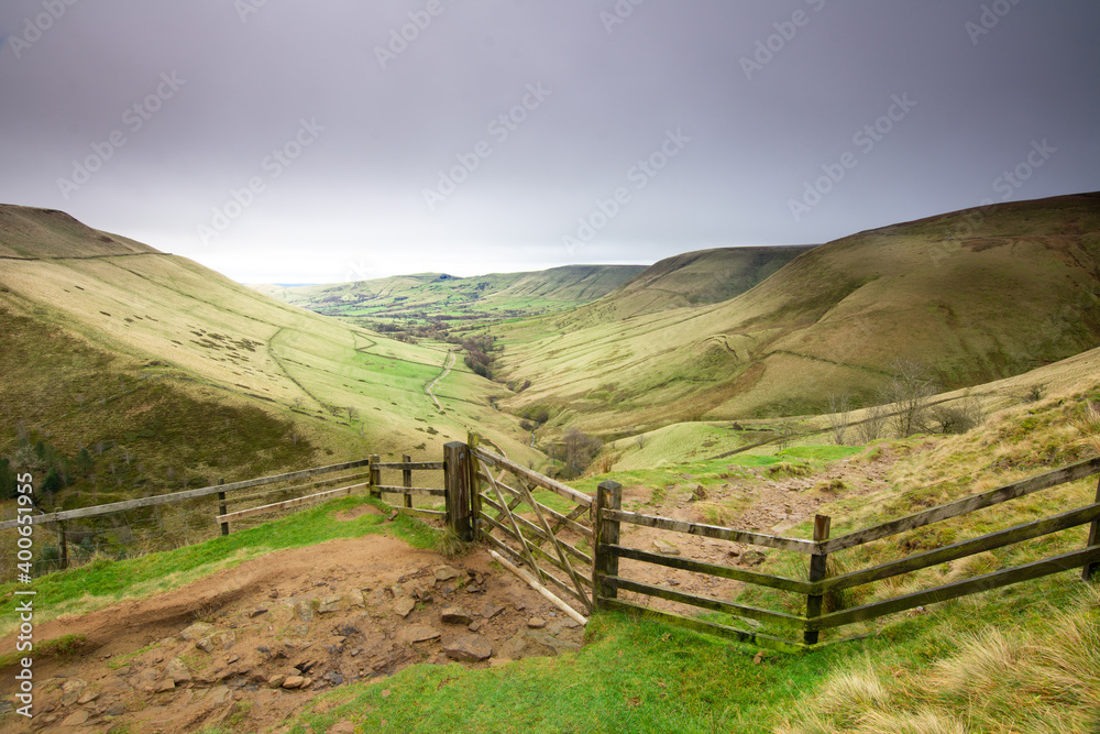 view of a valley from the way up to the summit barrier with a door in the foreground view of a valley from the way up to the summit barrier with a door in the foreground