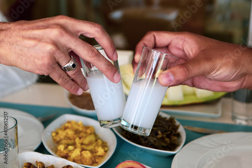 Turkish and Greek Traditional Dinning Table with Special Alcohol Drink Raki. Ouzo and Turkish Raki is a dry anise flavoured aperitif that is widely consumed in Turkey, Greece, Cyprus and Lebanon photo