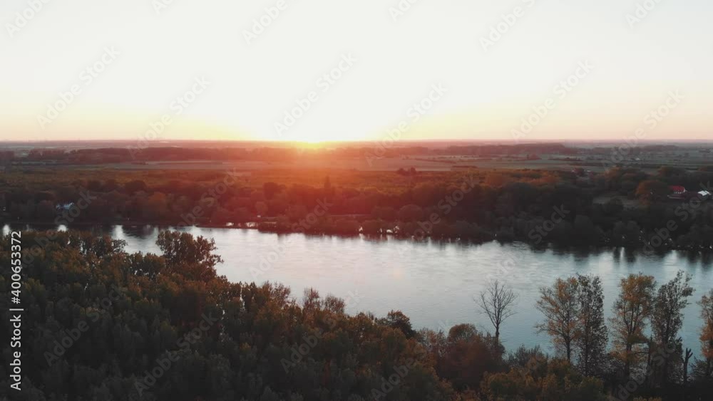 Aerial shot of the river Rhine in the area of Rheinland with the sunset in the horizon. Aerial shot of the river Rhine in the area of Rheinland with the sunset in the horizon.