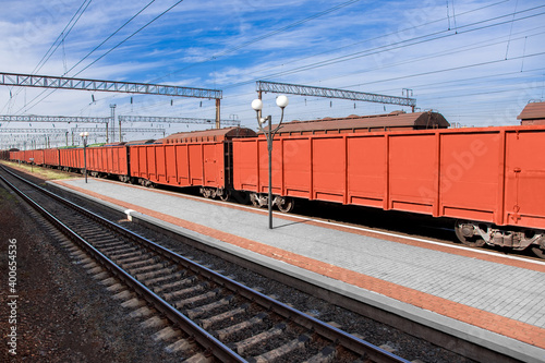 gondola car transports goods by rail to export raw materials, transport industry logistics products on a sunny day with a blue sky nobody.