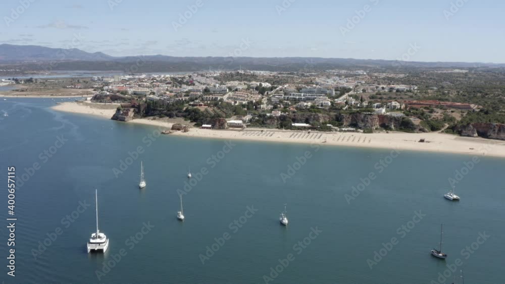 Sailboats out in the harbor outside Praia Do Mohle, Portugal, on beautiful sunny day Sailboats out in the harbor outside Praia Do Mohle, Portugal, on beautiful sunny day