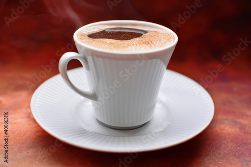 Photos Full to the brim white coffee cup on white porcelain saucer strong black invigor