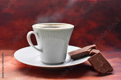 Bilde på lerret Full to the brim white coffee cup on white porcelain saucer strong black invigor