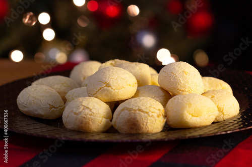 Cheese bread (Pão de Queijo) traditional bread from Brazil to eat with coffee, minas gerais, wooden table, christmas, new year, mineiro,