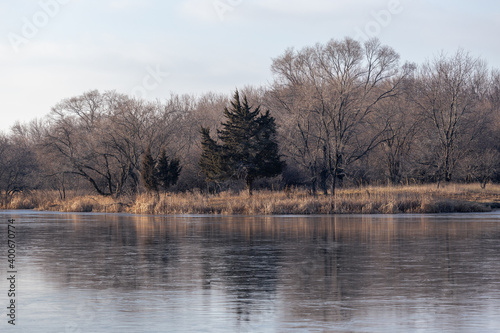 december landscape with frozen lake