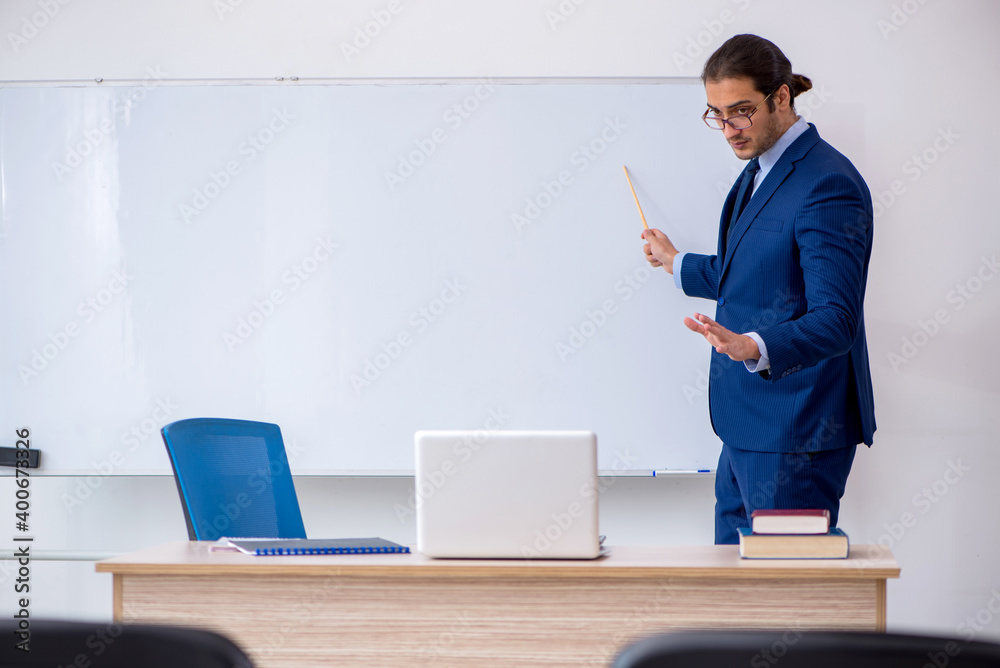 Young male business trainer in the office during pandemic Young male business trainer in the office during pandemic