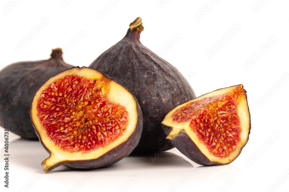 whole and sliced ripe sweet fig fruits isolated on white background whole and sliced ripe sweet fig fruits isolated on white background