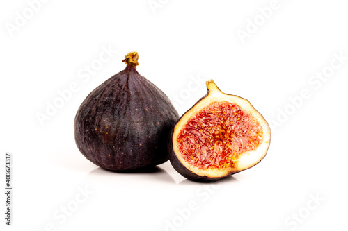 whole and half ripe sweet fig fruits isolated on white background