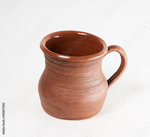 Pottery Craft  ceramic product with your own hands  made on a Potter s wheel  isolated on a white background.