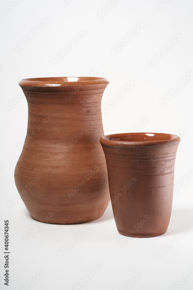 Pottery Craft, ceramic product with your own hands, made on a Potter's wheel, isolated on a white background. Pottery Craft, ceramic product with your own hands, made on a Potter's wheel, isolated on a white background.