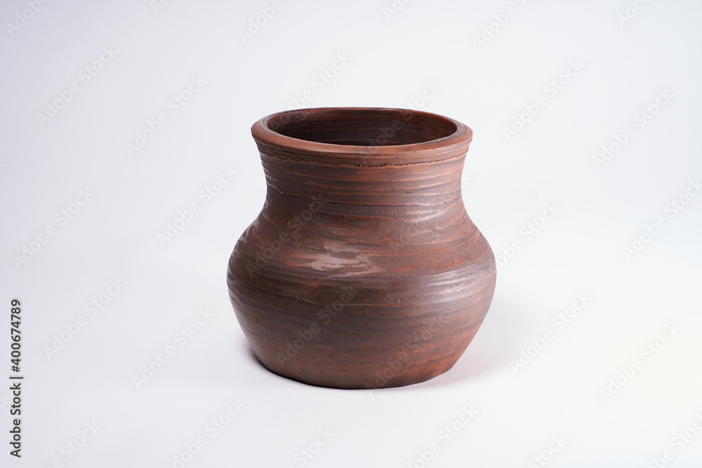 Pottery Craft, ceramic product with your own hands, made on a Potter's wheel, isolated on a white background.