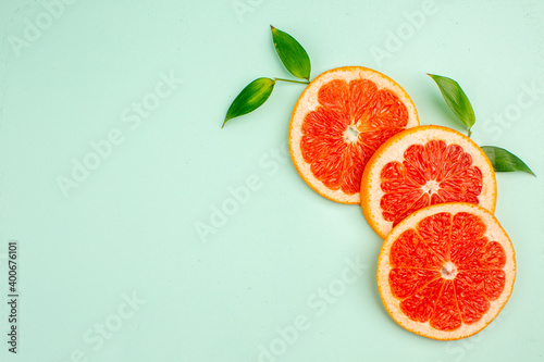 top view fresh tasty grapefruits on light-blue background diet color fresh healthy life fruit juice free space