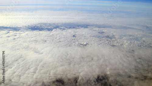 Aerial view of clouds and sky. Bird eye view from airplane window. Clouds panorama from airplane. Flight from Kiev to Sharm El Sheikh, Egypt.
