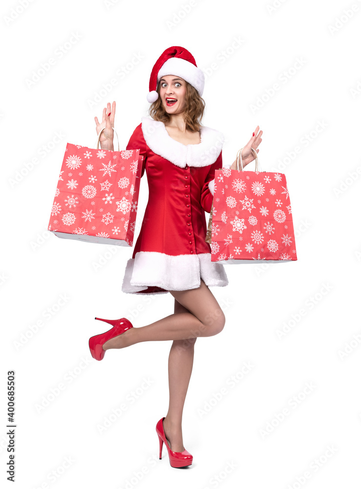 Happy young santa girl with packages of gifts, isolated on white background. Happy young santa girl with packages of gifts, isolated on white background.