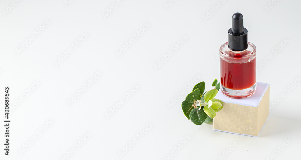 Oil serum bottle on white background. Natural cosmetic and substantiable eco packaging concept. Oil serum bottle on white background. Natural cosmetic and substantiable eco packaging concept.