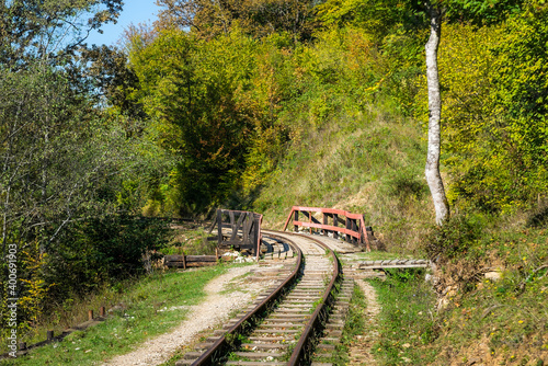 Old narrow gauge railway in mountain region.