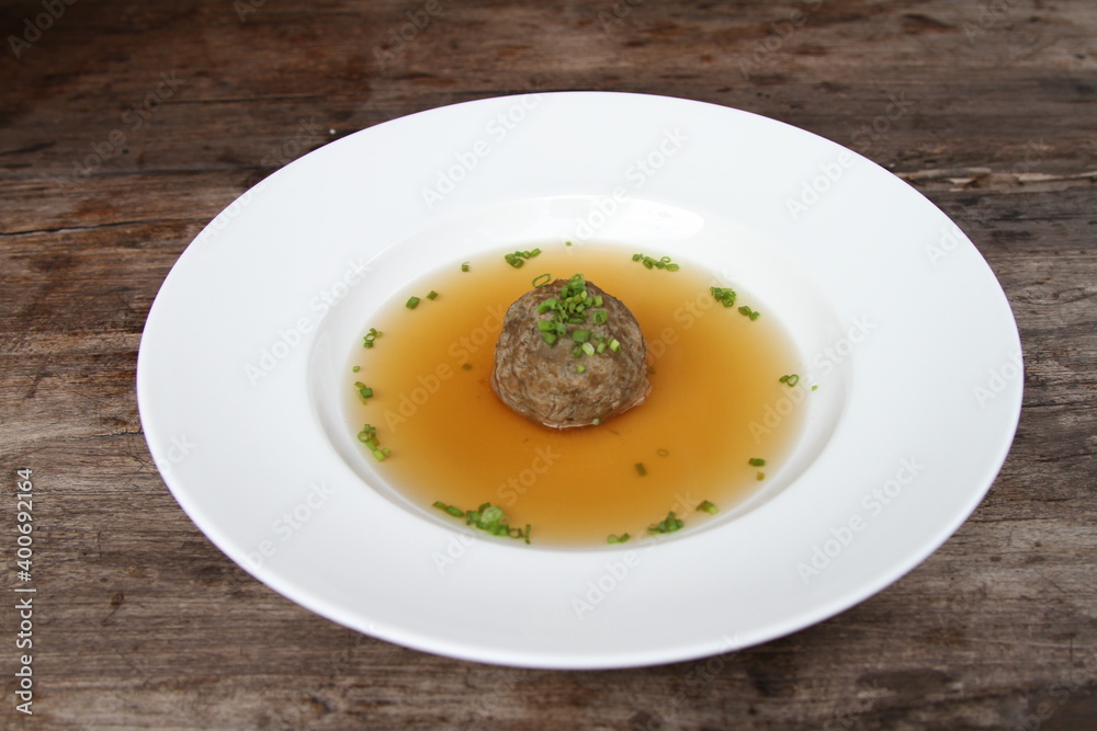 Traditional Austrian consomme with liver dumpling Traditional Austrian consomme with liver dumpling