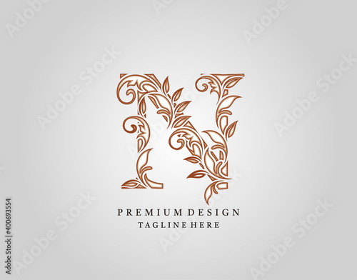 Calligraphic N Letter logo design, elegant floral ornate alphabet design vector.