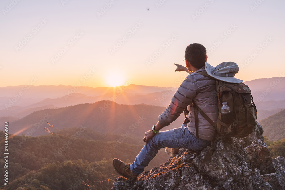 Asian tourist looking mountains sunset hilly valley