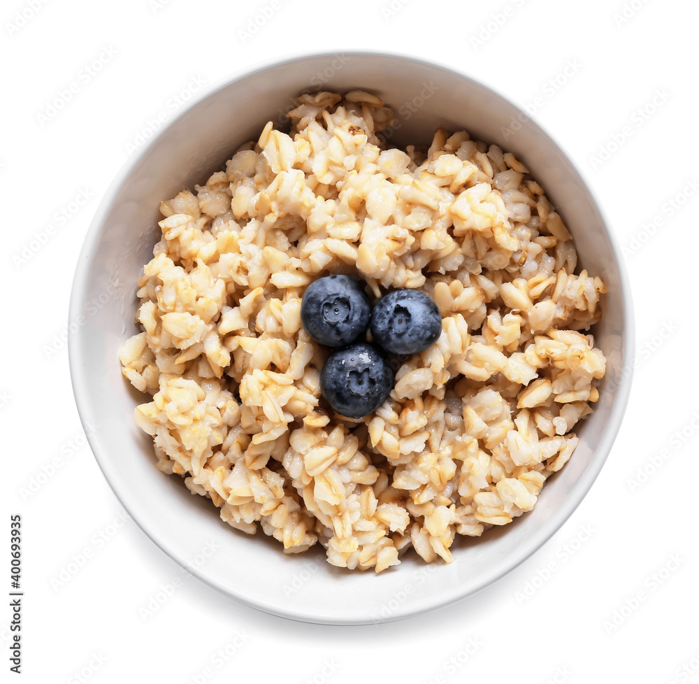 Bowl with tasty sweet oatmeal on white background Bowl with tasty sweet oatmeal on white background