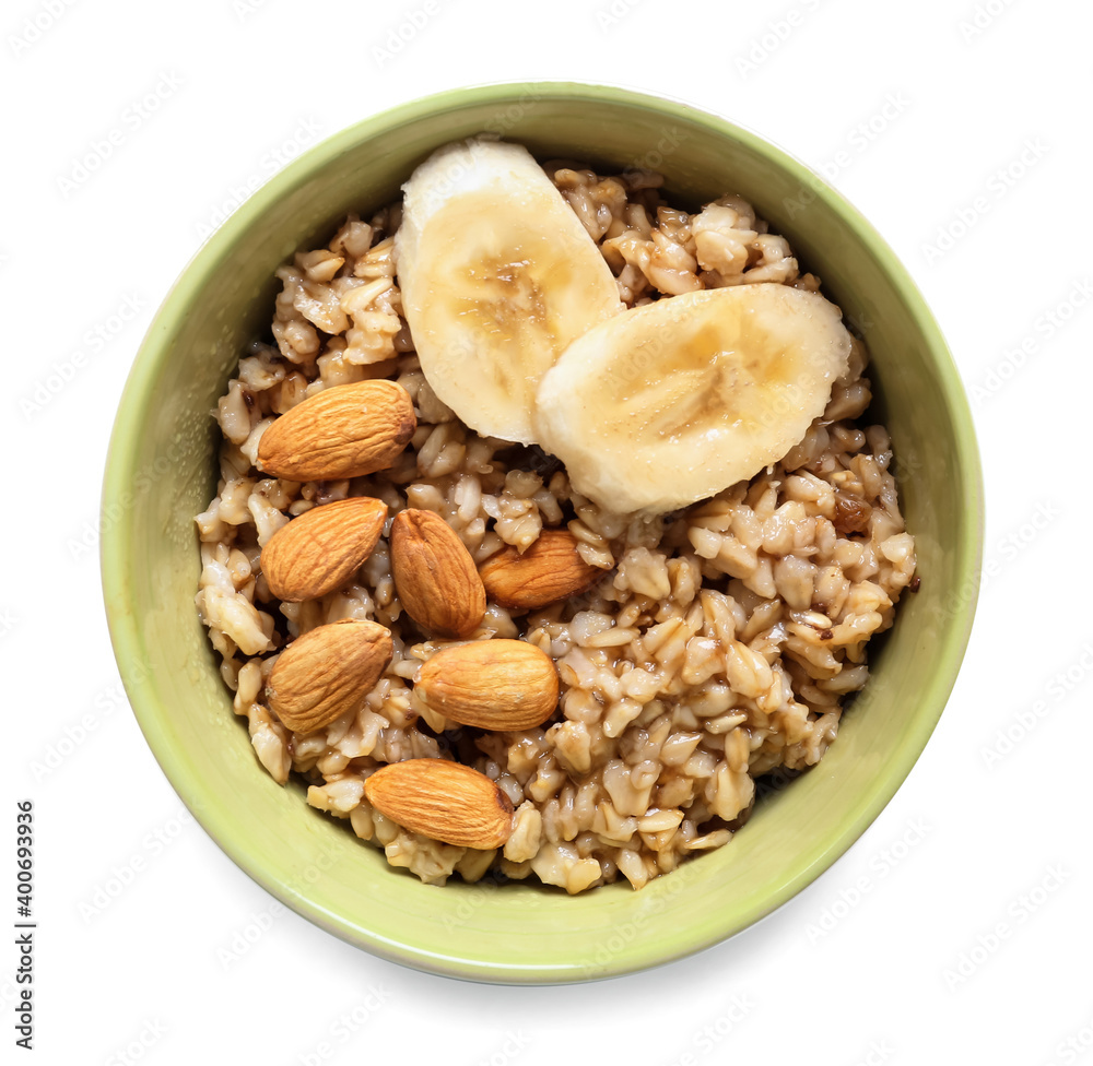Bowl with tasty sweet oatmeal on white background Bowl with tasty sweet oatmeal on white background