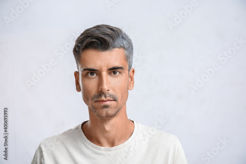Man with graying hair on li...