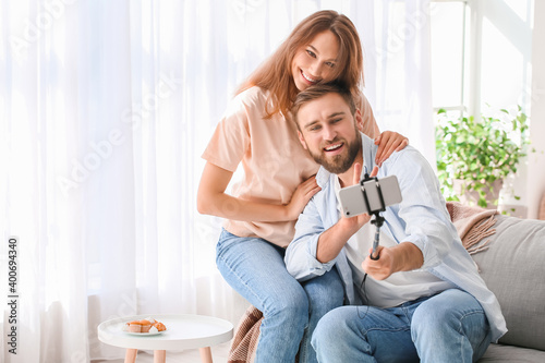 Happy young couple taking s...