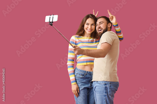 Young couple taking selfie ...