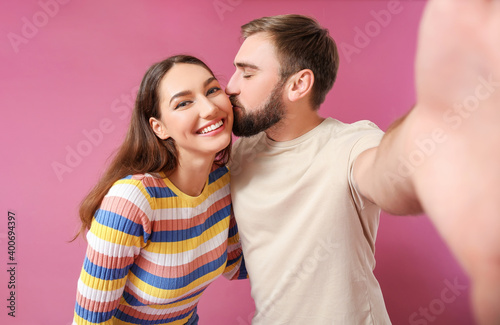 Young couple taking selfie ...