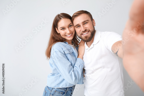 Young couple taking selfie ...