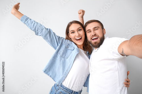 Young couple taking selfie ...