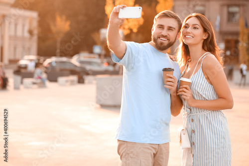 Young couple taking selfie ...
