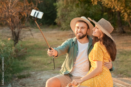 Young couple taking selfie ...