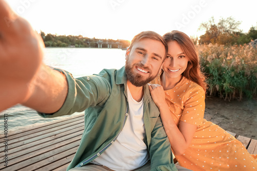 Young couple taking selfie ...