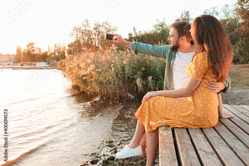 Young couple taking selfie ...