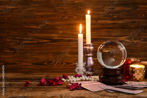 Accessories of fortune teller on table photo