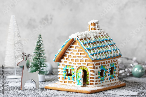 Beautiful gingerbread house and Christmas decor on table